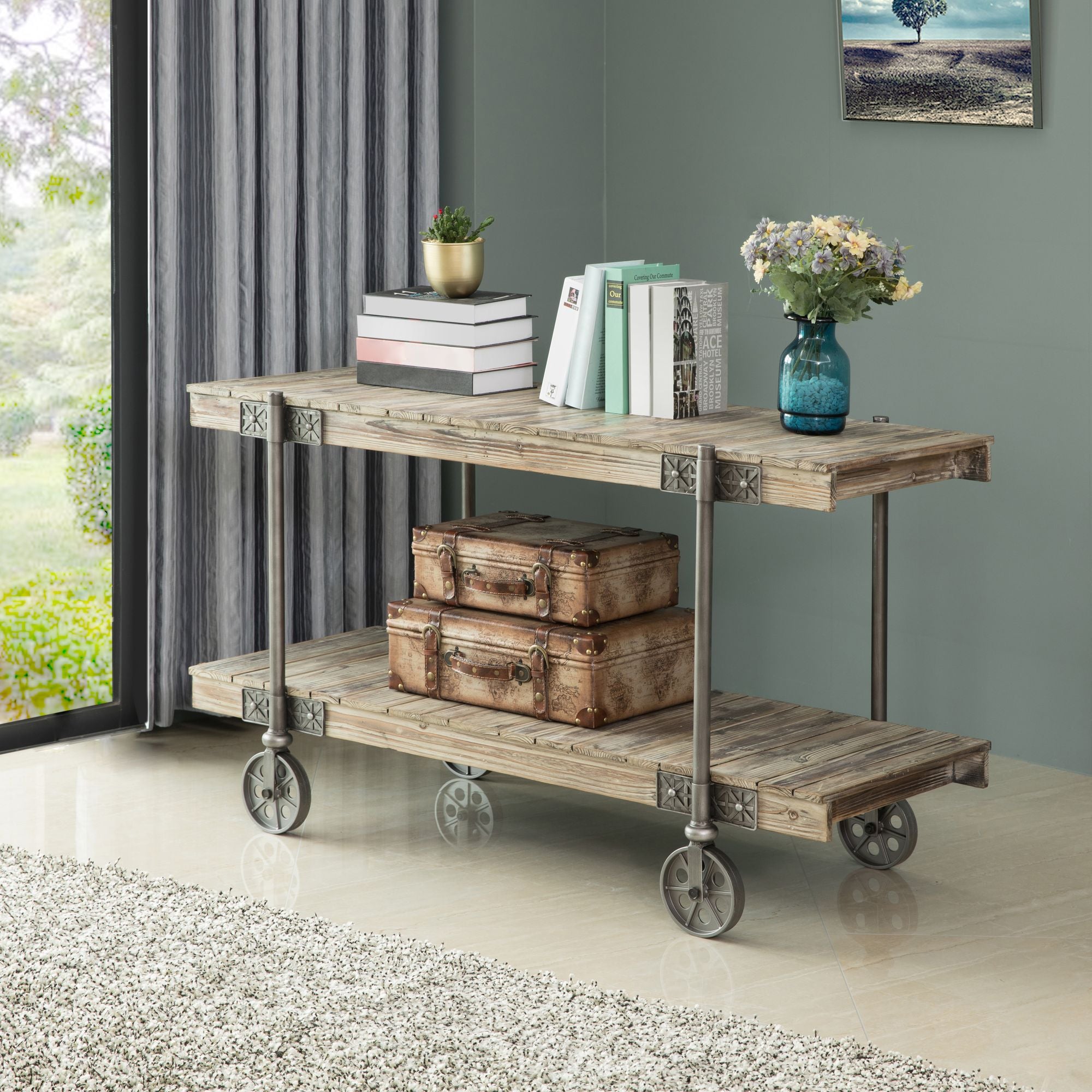 Factory cart console table with books and plants