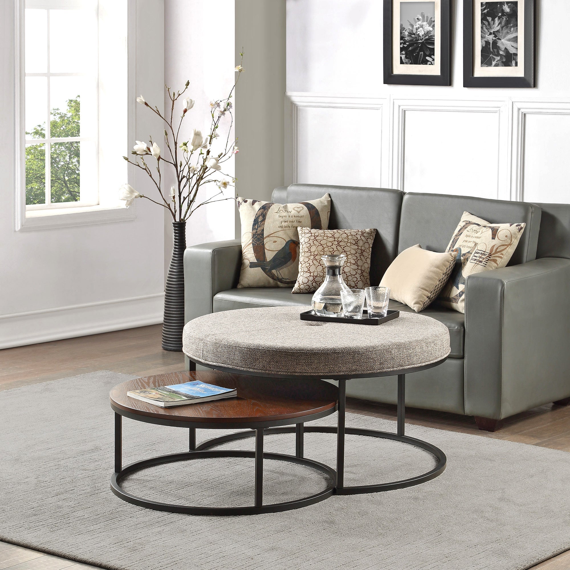 Gray upholstered ottoman and brown coffee table